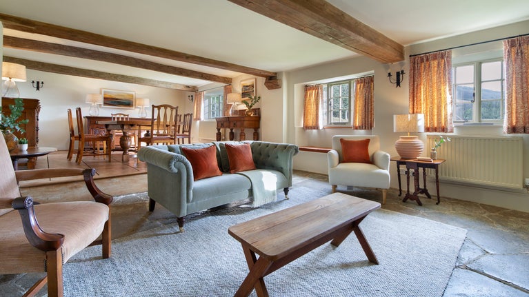 The open-plan sitting and dining room at Shedbush Farm House, Dorset